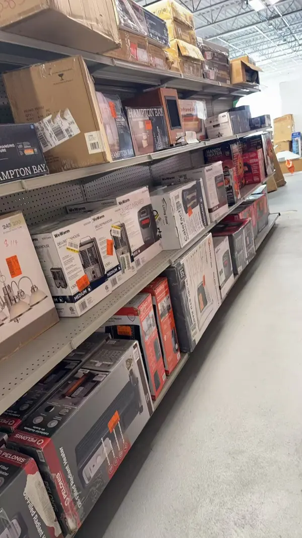 Small appliances aisle with microwaves and home electronics